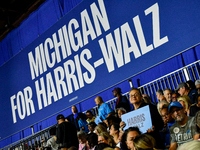 Attendees wait for former President Barack Obama to speak at a presidential campaign rally for Kamala Harris at The Huntington Place in Detr...