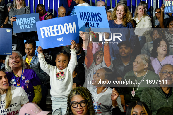 Attendees await former President Barack Obama to speak at a presidential campaign rally for Kamala Harris at The Huntington Place in Detroit...