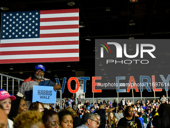 T. Couch, 66, in Detroit, MI, on October 22, 2024, holds up a Kamala Harris campaign sign while awaiting former President Barack Obama to sp...