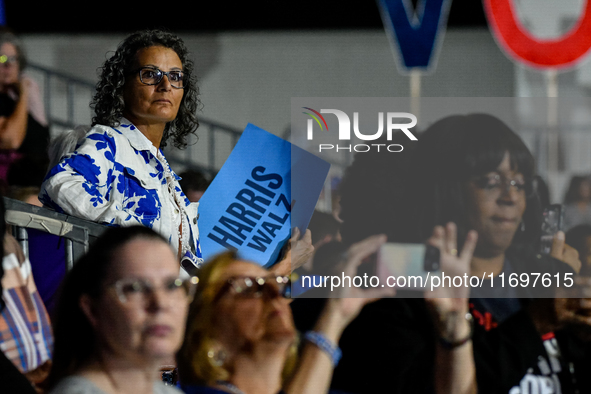 Attendees await former President Barack Obama to speak at a presidential campaign rally for Kamala Harris at The Huntington Place in Detroit...