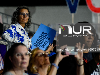 Attendees await former President Barack Obama to speak at a presidential campaign rally for Kamala Harris at The Huntington Place in Detroit...