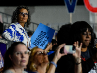 Attendees await former President Barack Obama to speak at a presidential campaign rally for Kamala Harris at The Huntington Place in Detroit...