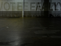 A shadow stating ''Vote Early'' is cast upon the back wall of The Huntington Place before former President Barack Obama speaks at a presiden...