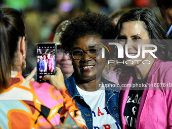 Michigan Governor Gretchen Whitmer pauses to take a photo with an attendee during a presidential campaign rally for Kamala Harris at The Hun...