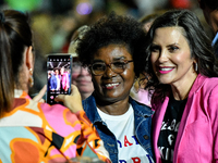 Michigan Governor Gretchen Whitmer pauses to take a photo with an attendee during a presidential campaign rally for Kamala Harris at The Hun...