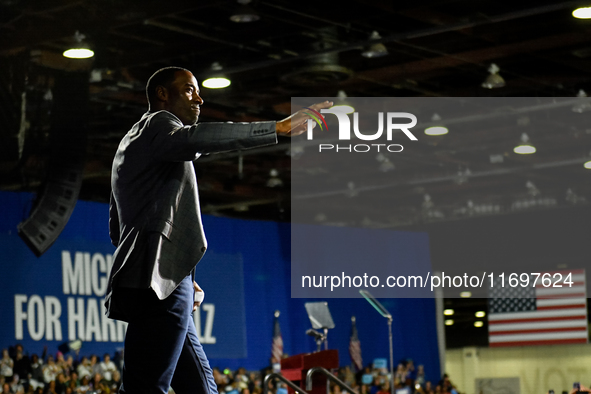 Former Detroit Lions wide receiver Calvin Johnson takes to the stage to speak during a presidential campaign rally for Kamala Harris at The...