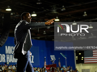 Former Detroit Lions wide receiver Calvin Johnson takes to the stage to speak during a presidential campaign rally for Kamala Harris at The...