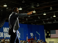 Former Detroit Lions wide receiver Calvin Johnson takes to the stage to speak during a presidential campaign rally for Kamala Harris at The...