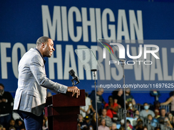 Former Detroit Lions wide receiver Calvin Johnson speaks during a presidential campaign rally for Kamala Harris at The Huntington Place in D...