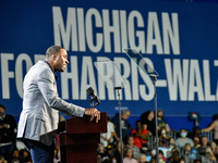 Former Detroit Lions wide receiver Calvin Johnson speaks during a presidential campaign rally for Kamala Harris at The Huntington Place in D...