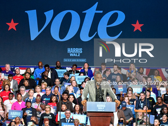 Former Detroit Lions wide receiver Calvin Johnson speaks during a presidential campaign rally for Kamala Harris at The Huntington Place in D...