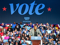 Former Detroit Lions wide receiver Calvin Johnson speaks during a presidential campaign rally for Kamala Harris at The Huntington Place in D...