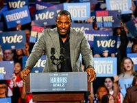 Former Detroit Lions wide receiver Calvin Johnson speaks during a presidential campaign rally for Kamala Harris at The Huntington Place in D...