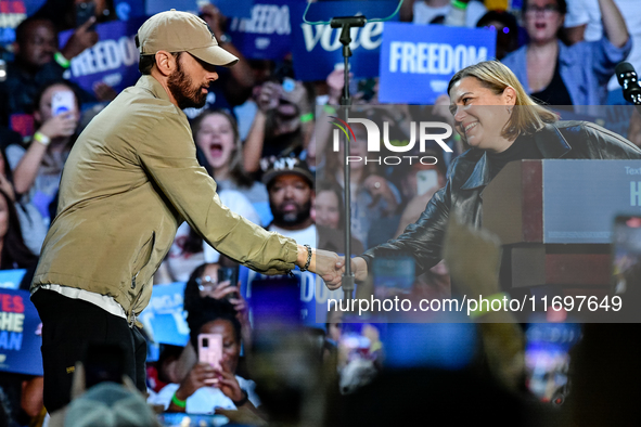 Candidate for U.S. Senator Elissa Slotkin (D-MI) welcomes Eminem on stage to speak during a presidential campaign rally for Kamala Harris at...