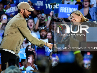 Candidate for U.S. Senator Elissa Slotkin (D-MI) welcomes Eminem on stage to speak during a presidential campaign rally for Kamala Harris at...