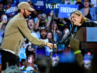 Candidate for U.S. Senator Elissa Slotkin (D-MI) welcomes Eminem on stage to speak during a presidential campaign rally for Kamala Harris at...