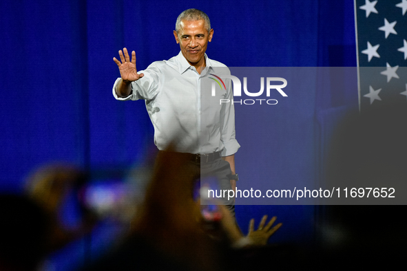 Former President Barack Obama takes to the stage to speak at a presidential campaign rally for Kamala Harris at The Huntington Place in Detr...