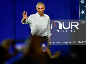 Former President Barack Obama takes to the stage to speak at a presidential campaign rally for Kamala Harris at The Huntington Place in Detr...