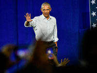 Former President Barack Obama takes to the stage to speak at a presidential campaign rally for Kamala Harris at The Huntington Place in Detr...