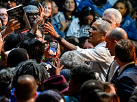 Former President Barack Obama shakes the hands of attendees at the conclusion of a presidential campaign rally for Kamala Harris at The Hunt...