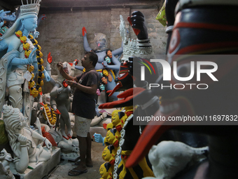 An artisan makes an idol of the Hindu Goddess Kali in Kumartuli, the potter's village in Kolkata, India, on October 22, 2024. (