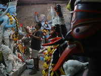 An artisan makes an idol of the Hindu Goddess Kali in Kumartuli, the potter's village in Kolkata, India, on October 22, 2024. (