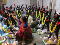 An artisan makes an idol of the Hindu Goddess Kali in Kumartuli, the potter's village in Kolkata, India, on October 22, 2024. (