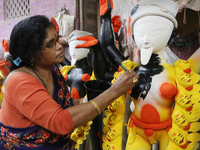 The idol-maker China Pal makes an idol of the Hindu Goddess Kali ahead of the Kali Puja Festival in Kumartuli, the potter's village in Kolka...