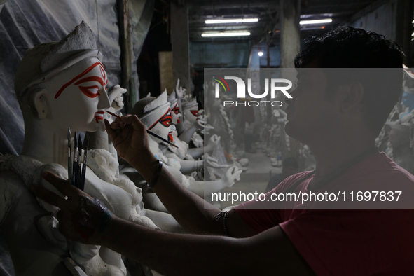 An artisan makes an idol of the Hindu Goddess Kali in Kumartuli, the potter's village in Kolkata, India, on October 22, 2024. 