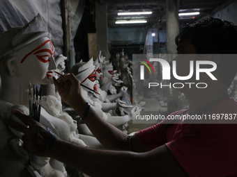 An artisan makes an idol of the Hindu Goddess Kali in Kumartuli, the potter's village in Kolkata, India, on October 22, 2024. (