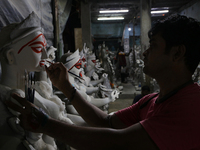 An artisan makes an idol of the Hindu Goddess Kali in Kumartuli, the potter's village in Kolkata, India, on October 22, 2024. (