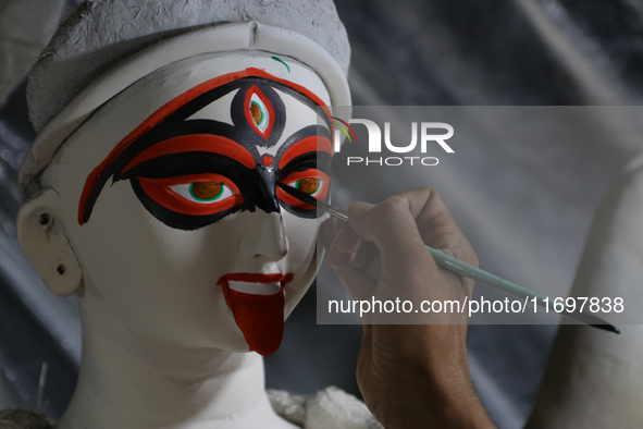 An artisan makes an idol of the Hindu Goddess Kali in Kumartuli, the potter's village in Kolkata, India, on October 22, 2024. 