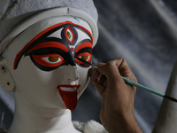 An artisan makes an idol of the Hindu Goddess Kali in Kumartuli, the potter's village in Kolkata, India, on October 22, 2024. (