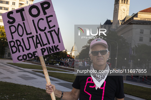 A person holds a sign during the National Day of Protest to Stop Police Brutality at the Freedom Plaza in Washington, D.C., United States, o...