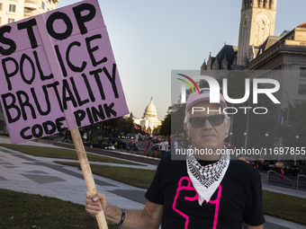 A person holds a sign during the National Day of Protest to Stop Police Brutality at the Freedom Plaza in Washington, D.C., United States, o...