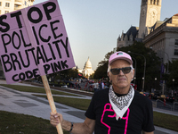 A person holds a sign during the National Day of Protest to Stop Police Brutality at the Freedom Plaza in Washington, D.C., United States, o...