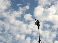 Birds sit on a mobile signal tower as clouds are seen in the sky in Siliguri, India, on October 23, 2024. (