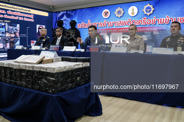 An official of the Narcotics Control Board displays a confiscated 154 kilograms of heroin hidden in their van to be smuggled from Thailand's...