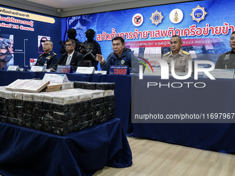 An official of the Narcotics Control Board displays a confiscated 154 kilograms of heroin hidden in their van to be smuggled from Thailand's...