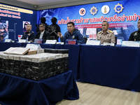 An official of the Narcotics Control Board displays a confiscated 154 kilograms of heroin hidden in their van to be smuggled from Thailand's...