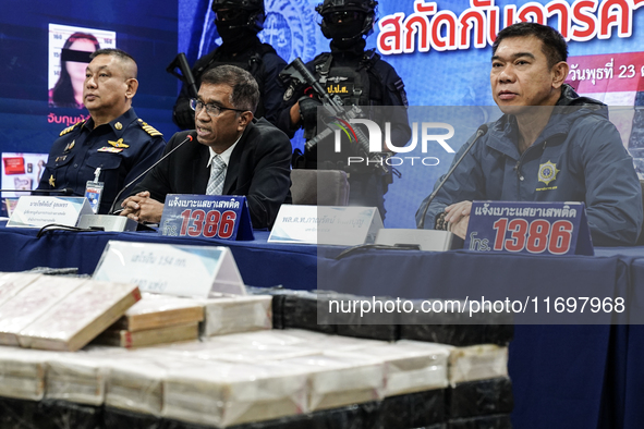 An official of the Narcotics Control Board displays a confiscated 154 kilograms of heroin hidden in their van to be smuggled from Thailand's...