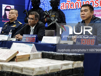 An official of the Narcotics Control Board displays a confiscated 154 kilograms of heroin hidden in their van to be smuggled from Thailand's...