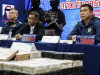 An official of the Narcotics Control Board displays a confiscated 154 kilograms of heroin hidden in their van to be smuggled from Thailand's...