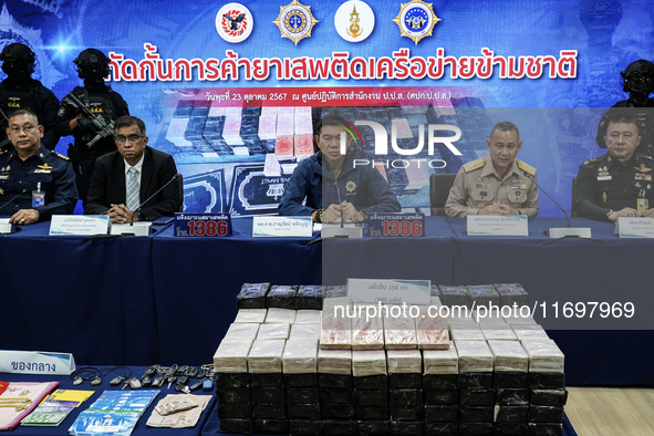 An official of the Narcotics Control Board displays a confiscated 154 kilograms of heroin hidden in their van to be smuggled from Thailand's...