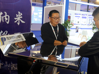 Visitors attend the 14th China International Nanotechnology Industry Expo in Suzhou, China, on October 23, 2024. (