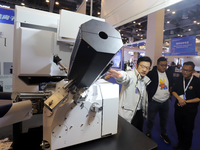 Visitors attend the 14th China International Nanotechnology Industry Expo in Suzhou, China, on October 23, 2024. (