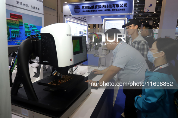 Visitors attend the 14th China International Nanotechnology Industry Expo in Suzhou, China, on October 23, 2024. 