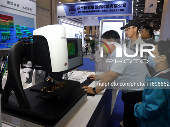 Visitors attend the 14th China International Nanotechnology Industry Expo in Suzhou, China, on October 23, 2024. (