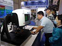 Visitors attend the 14th China International Nanotechnology Industry Expo in Suzhou, China, on October 23, 2024. (