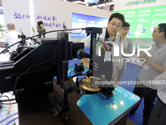 Visitors attend the 14th China International Nanotechnology Industry Expo in Suzhou, China, on October 23, 2024. (